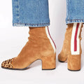 Trendy burgundy ankle boots with a supportive insole, ideal for all-day wear and winter outings.