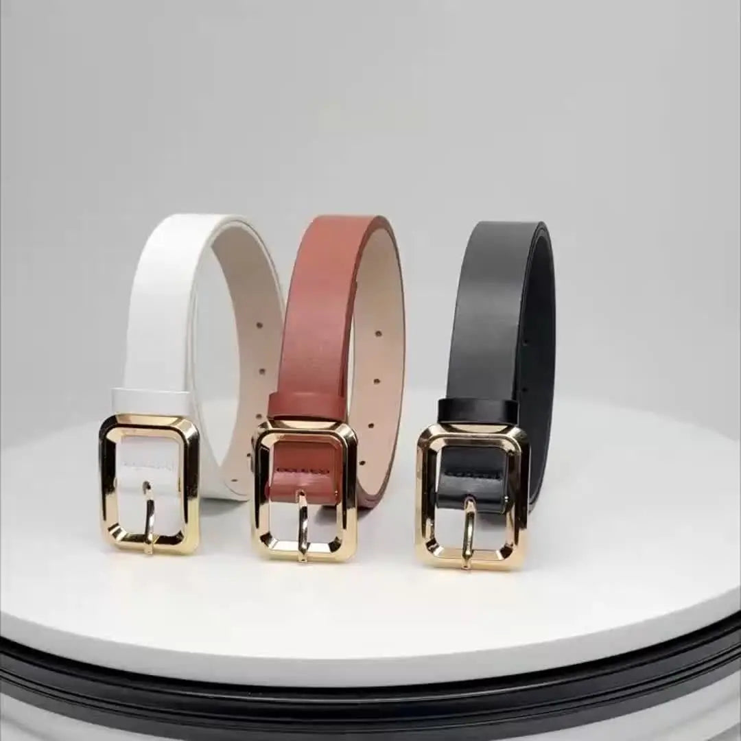 Transformative accessory: golden buckle belt paired with a casual outfit.