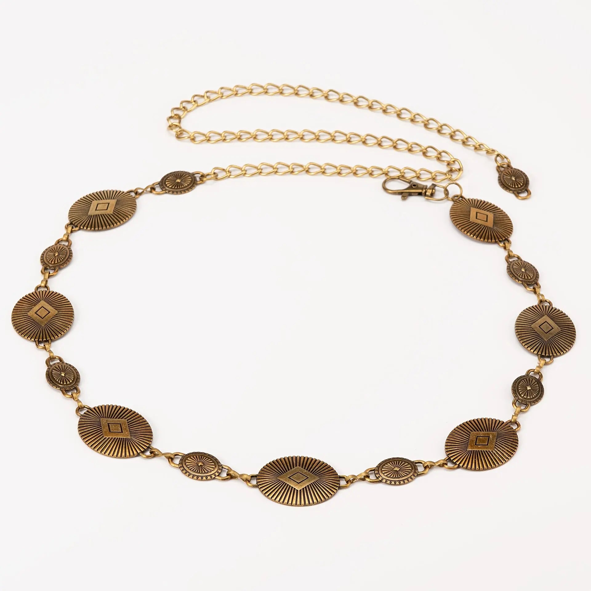 Golden Hour Glow waist chain with intricate artisan carvings and soft metallic sheen.