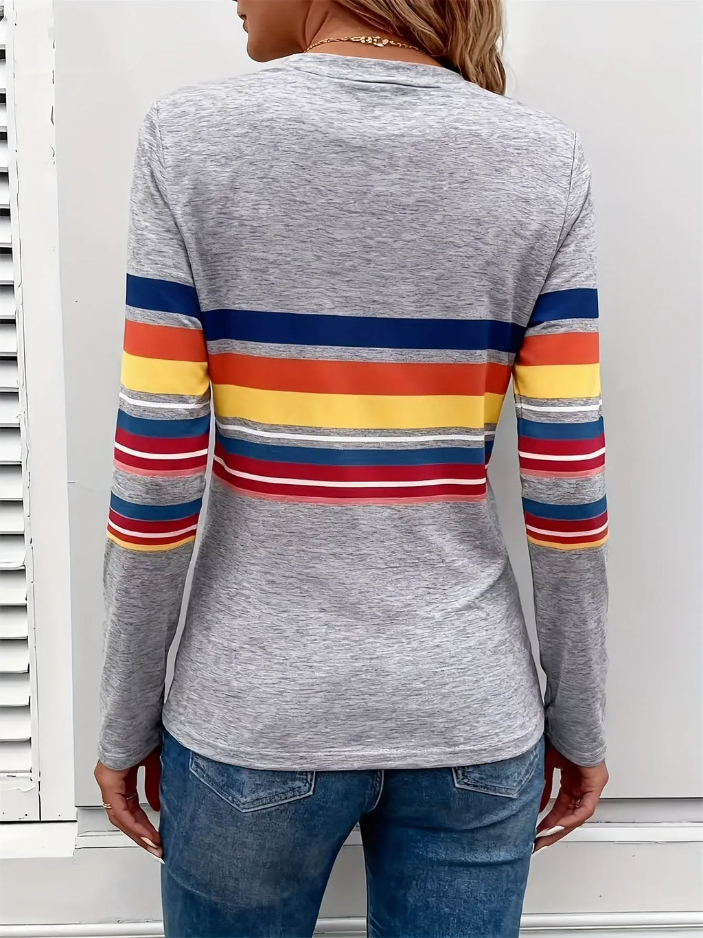 Back view of the Radiant Stripes Tee, emphasizing the medium stretch fabric and vibrant multicolor pattern.