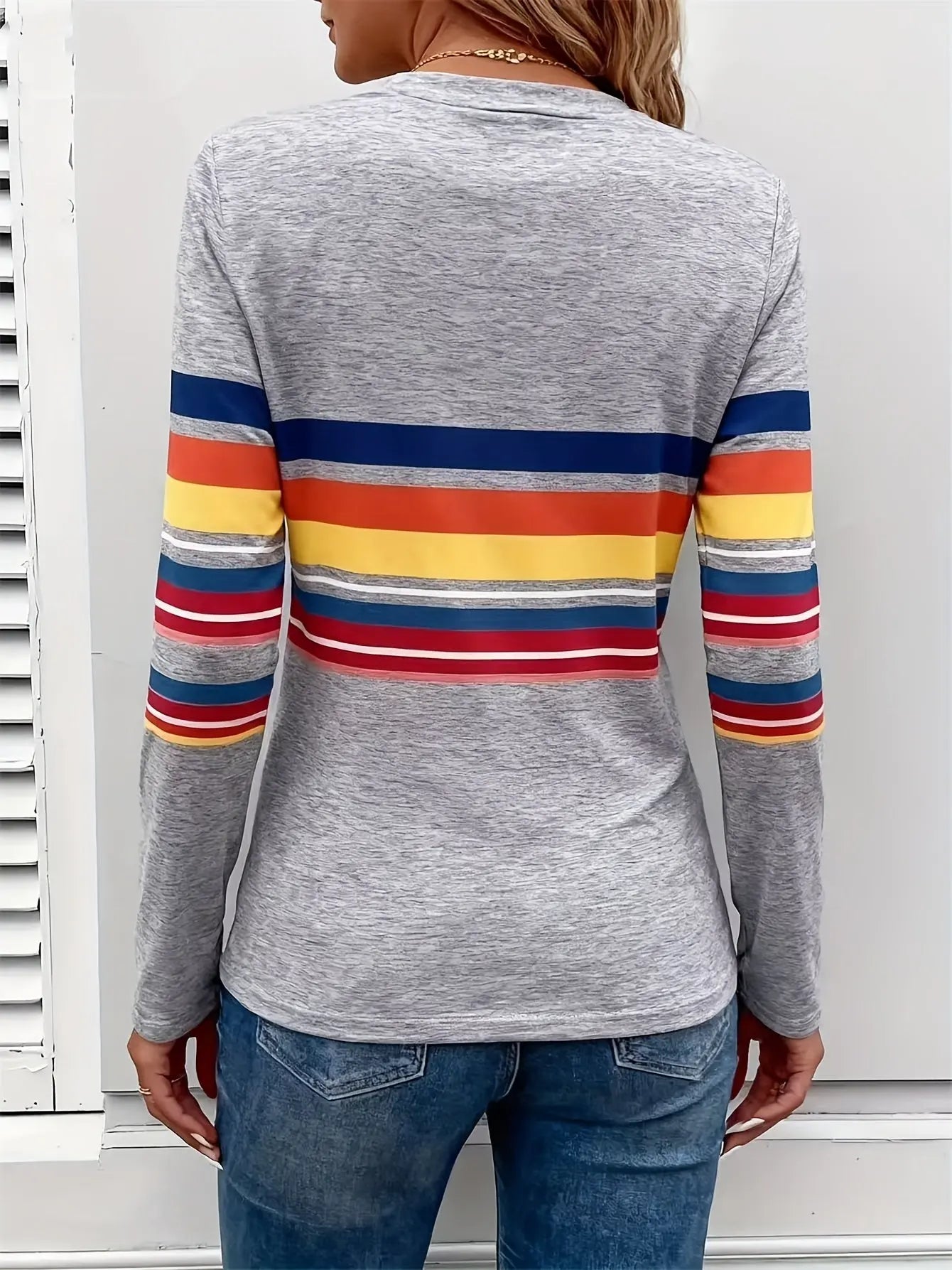 Back view of the Radiant Stripes Tee, emphasizing the medium stretch fabric and vibrant multicolor pattern.