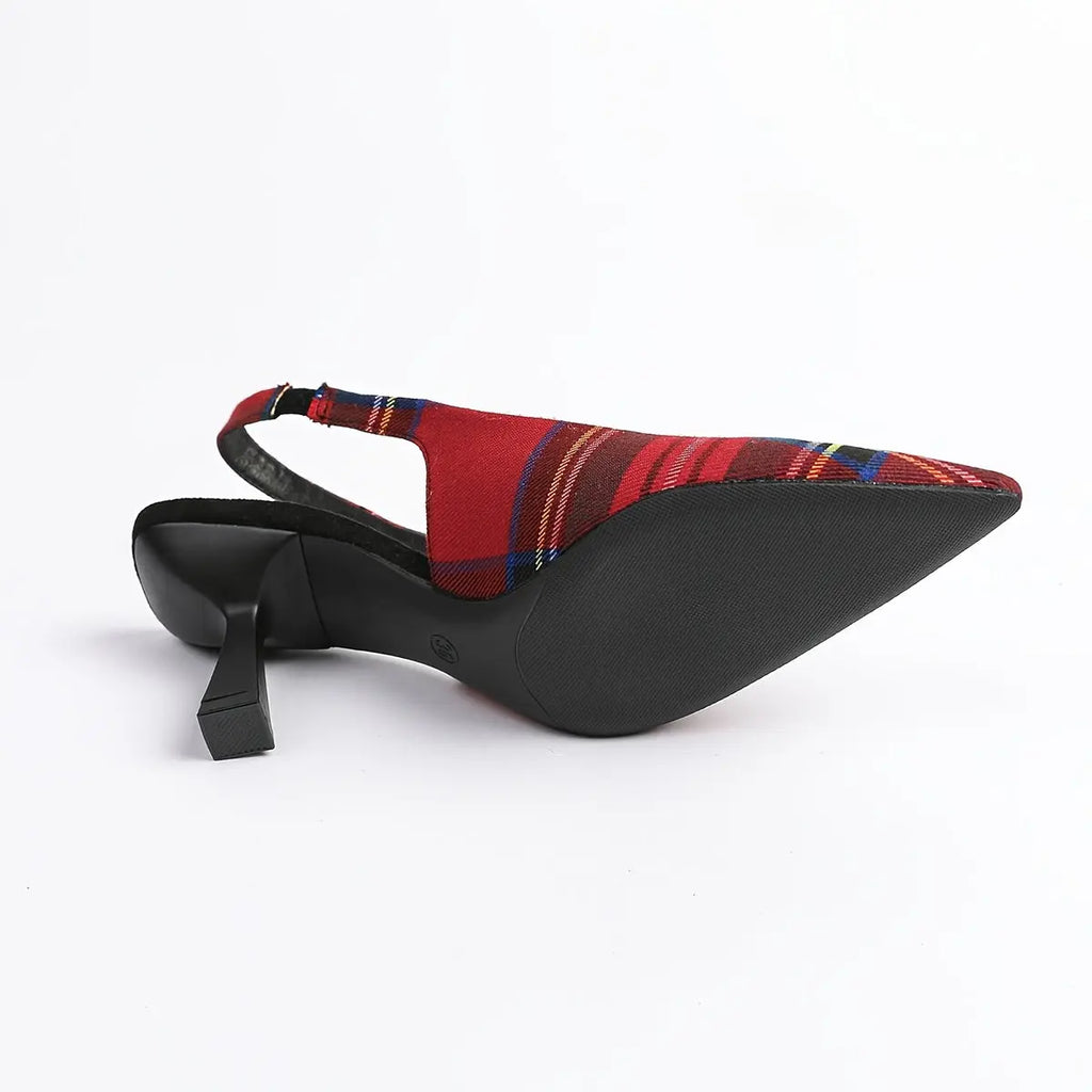 Elegant plaid design on pointed-toe mules showcasing architectural elegance.