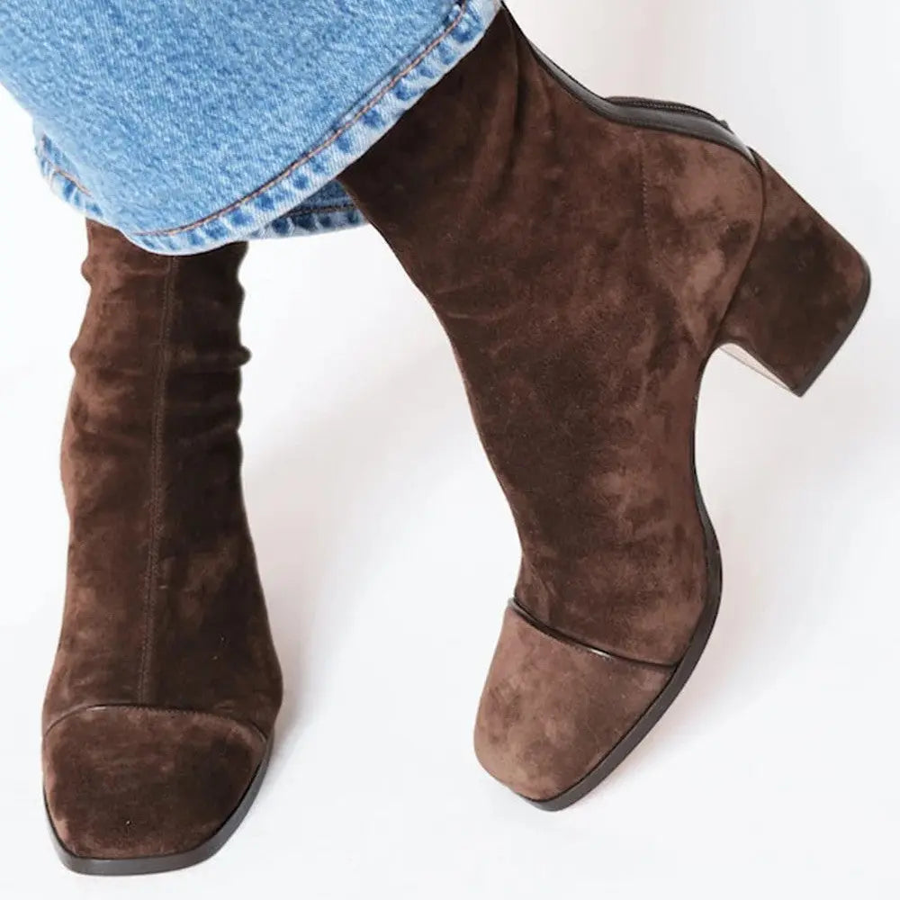 Stylish brown vintage-inspired ankle boots featuring a durable design and comfortable insole.
