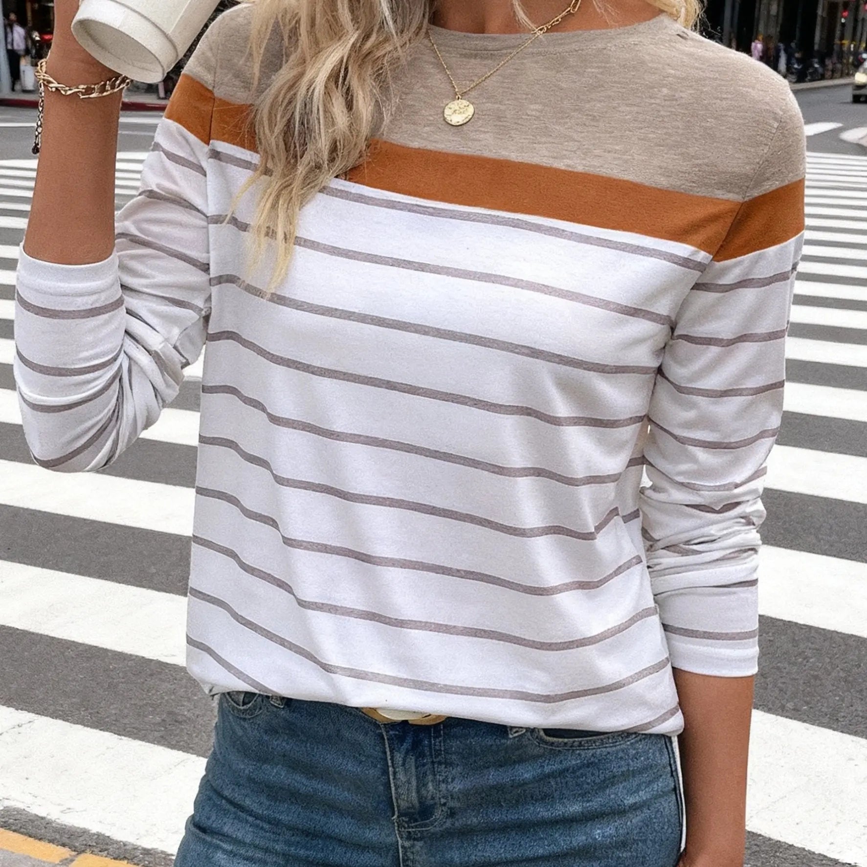 Sea Breeze Stripes blouse in a vibrant setting, highlighting its all-season versatility.