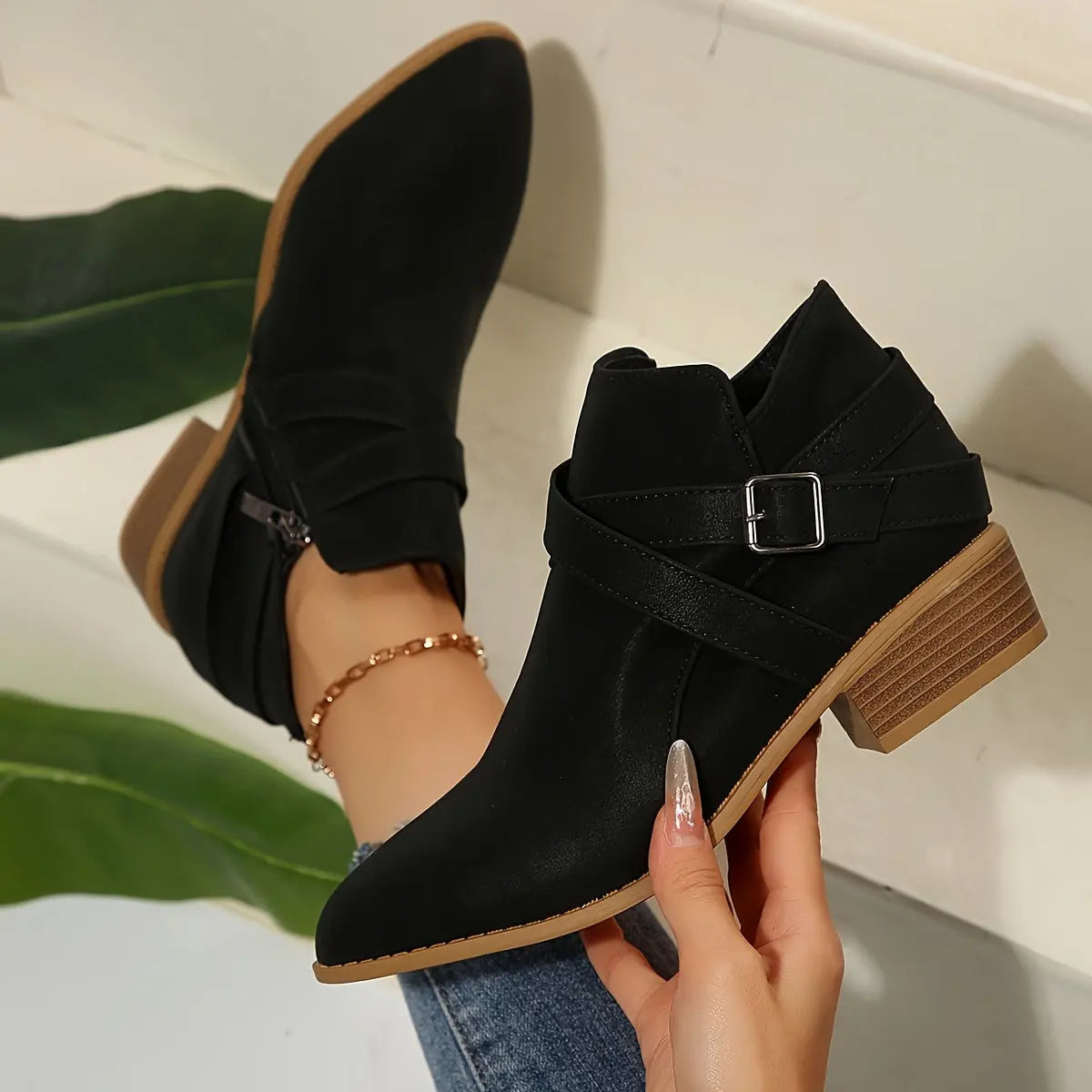 Olive block heel boots in a chic urban setting, perfect for modern women.