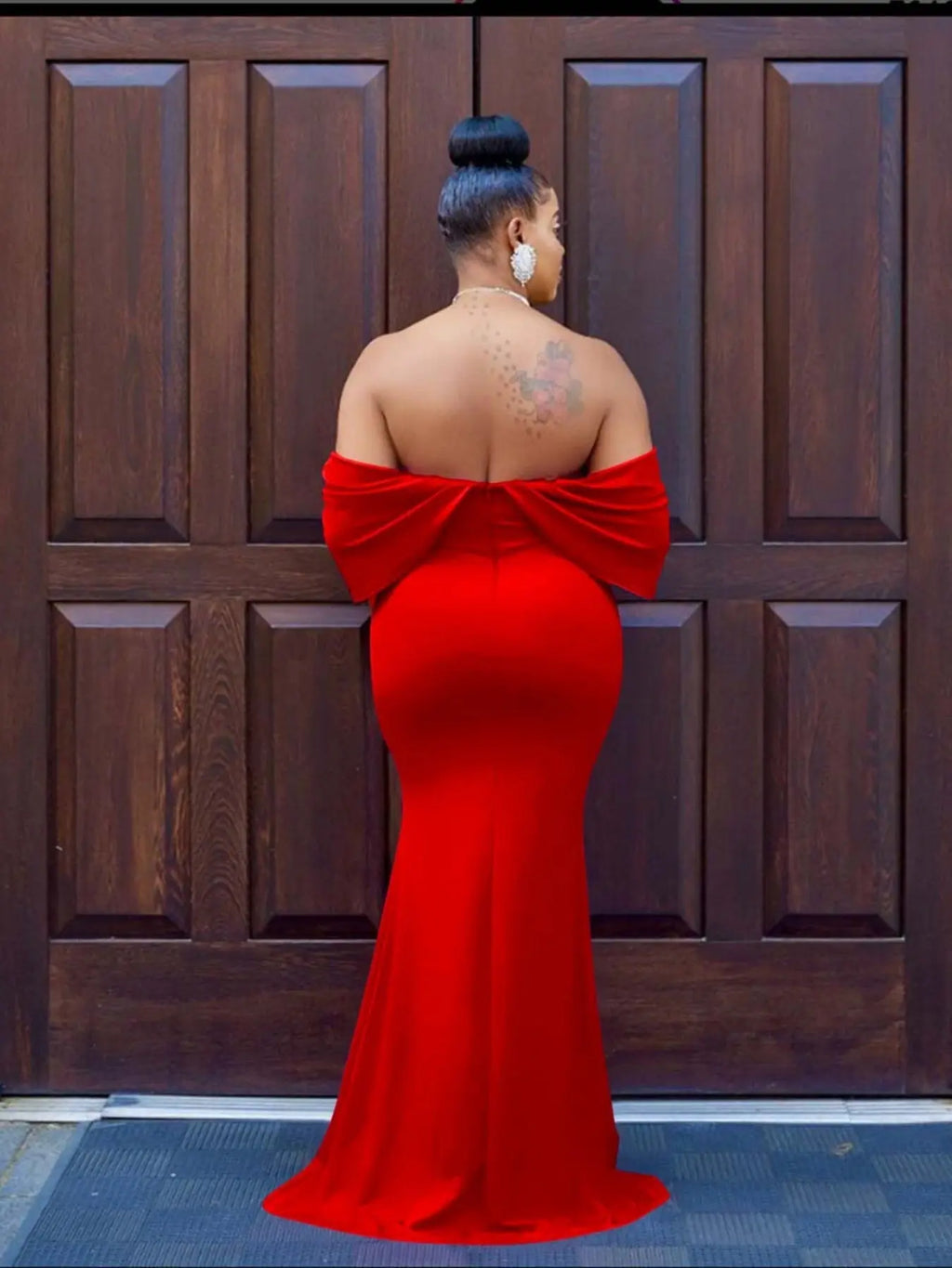 Model twirling in the Scarlet Ruffle Dress, showcasing its ruffle movement.
