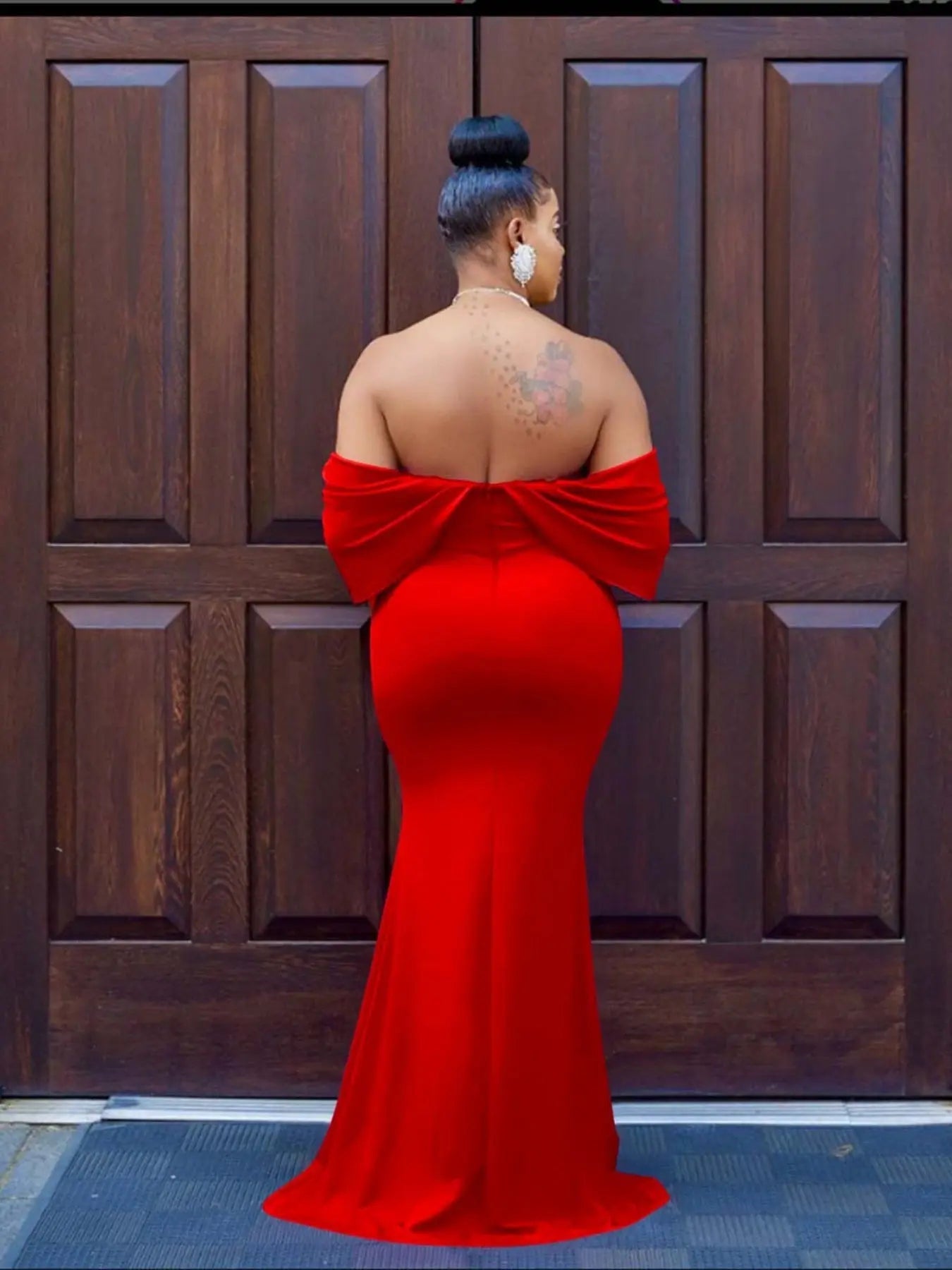 Model twirling in the Scarlet Ruffle Dress, showcasing its ruffle movement.