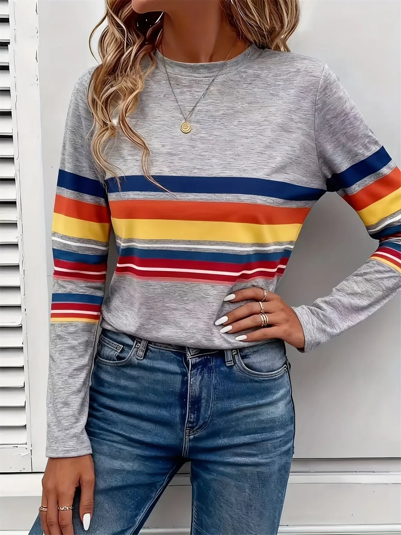 Close-up of the Radiant Stripes Tee showcasing its colorful bold stripe design and comfortable stretch fabric.