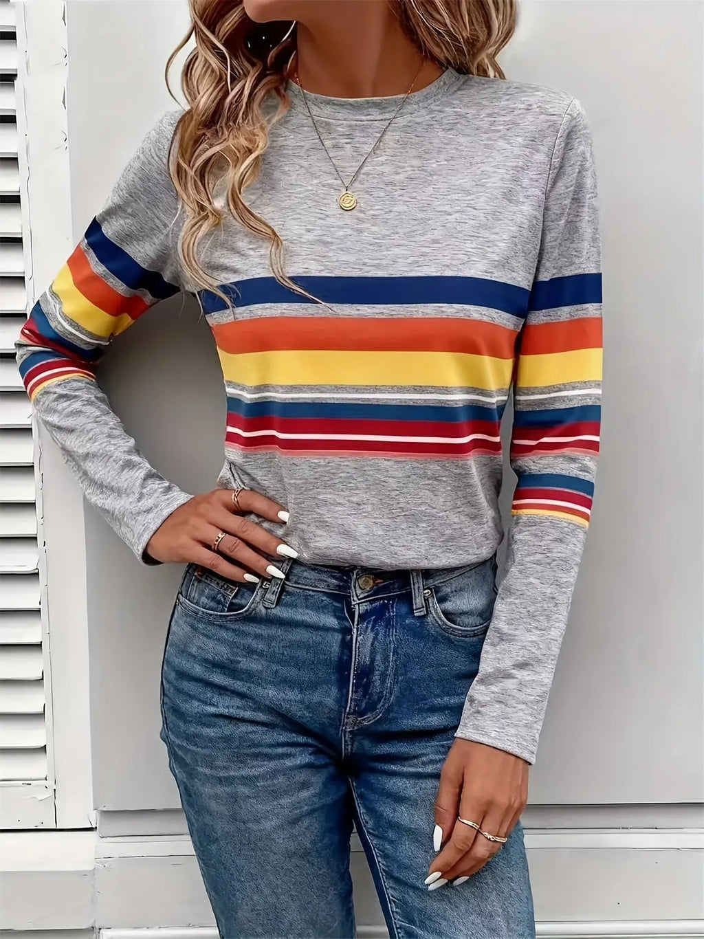 Model wearing the Radiant Stripes Tee paired with jeans, highlighting its casual chic style and versatility.