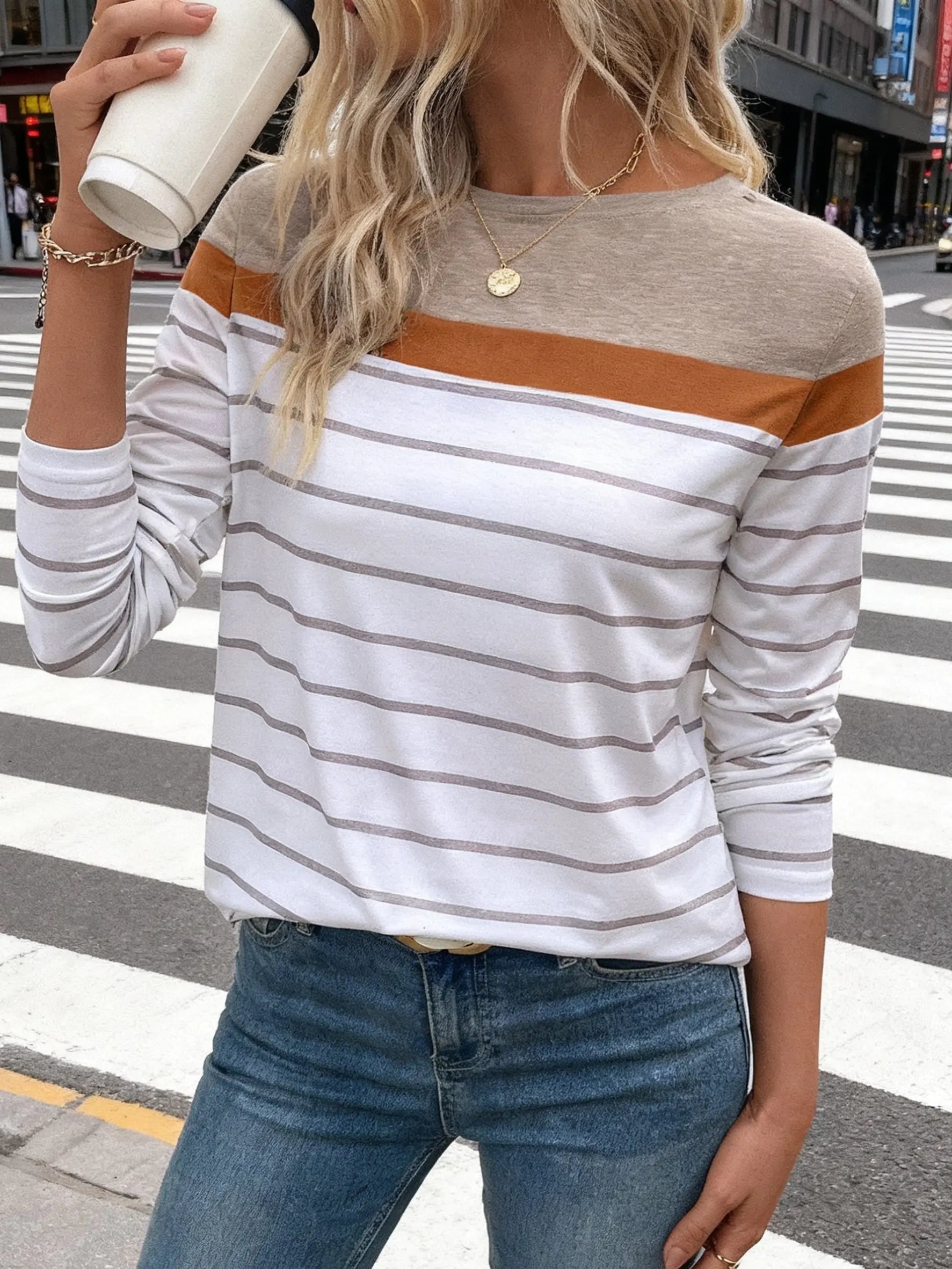 Model wearing Sea Breeze Stripes top, styled for casual chic weekend wear.