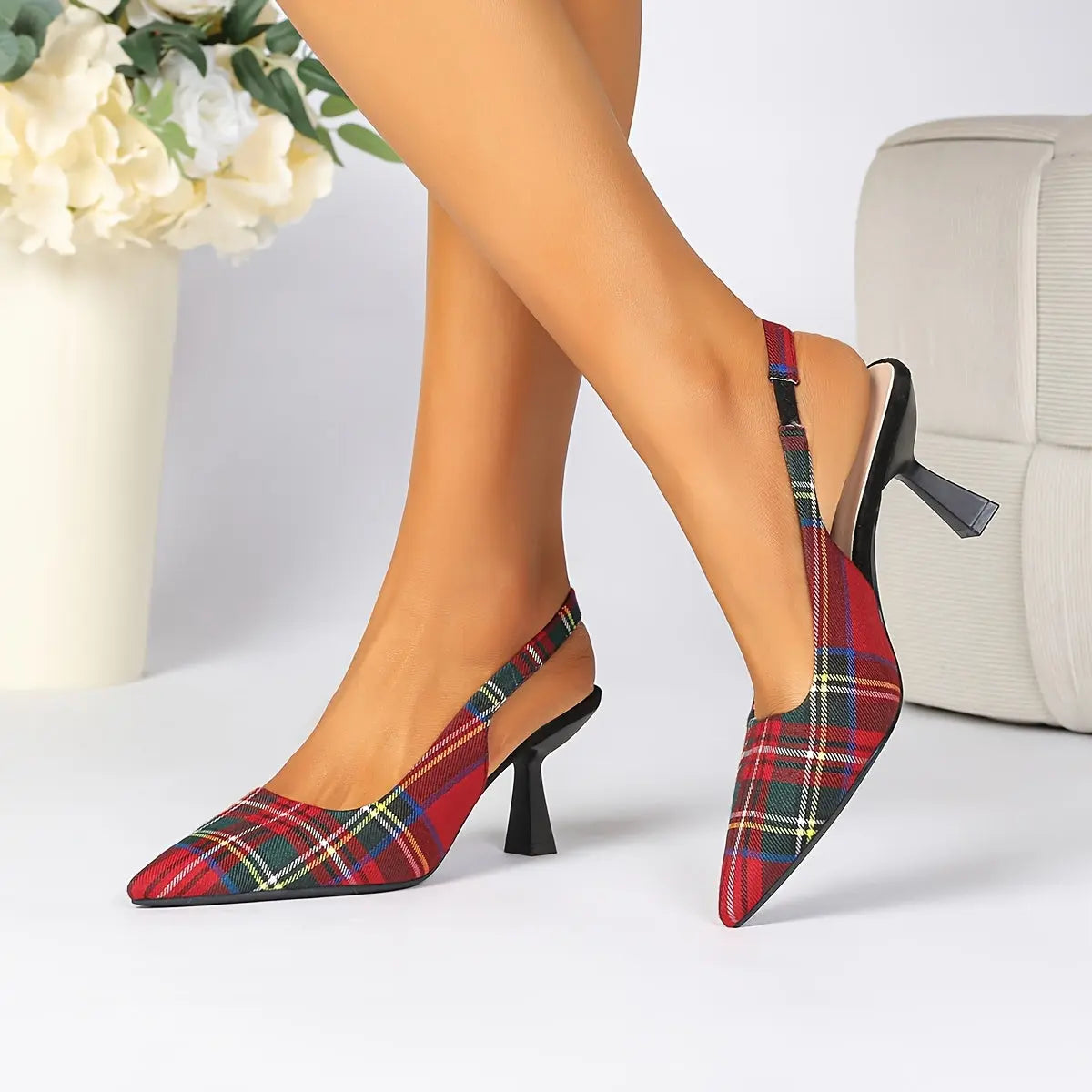 Plaid pointed-toe mules with high stiletto heels in chic vintage style.
