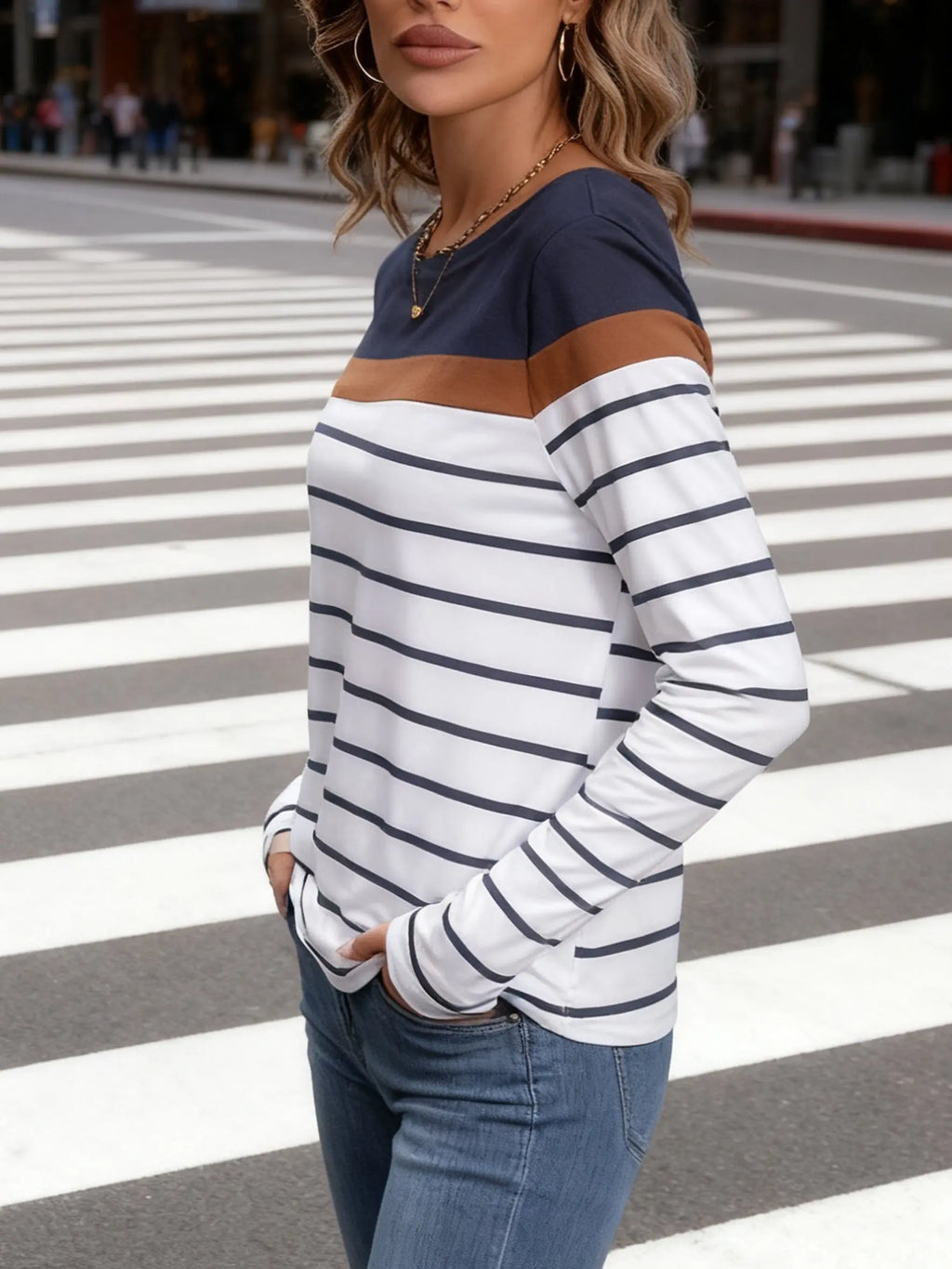 Side view of Sea Breeze Stripes blouse, illustrating its graceful movement.