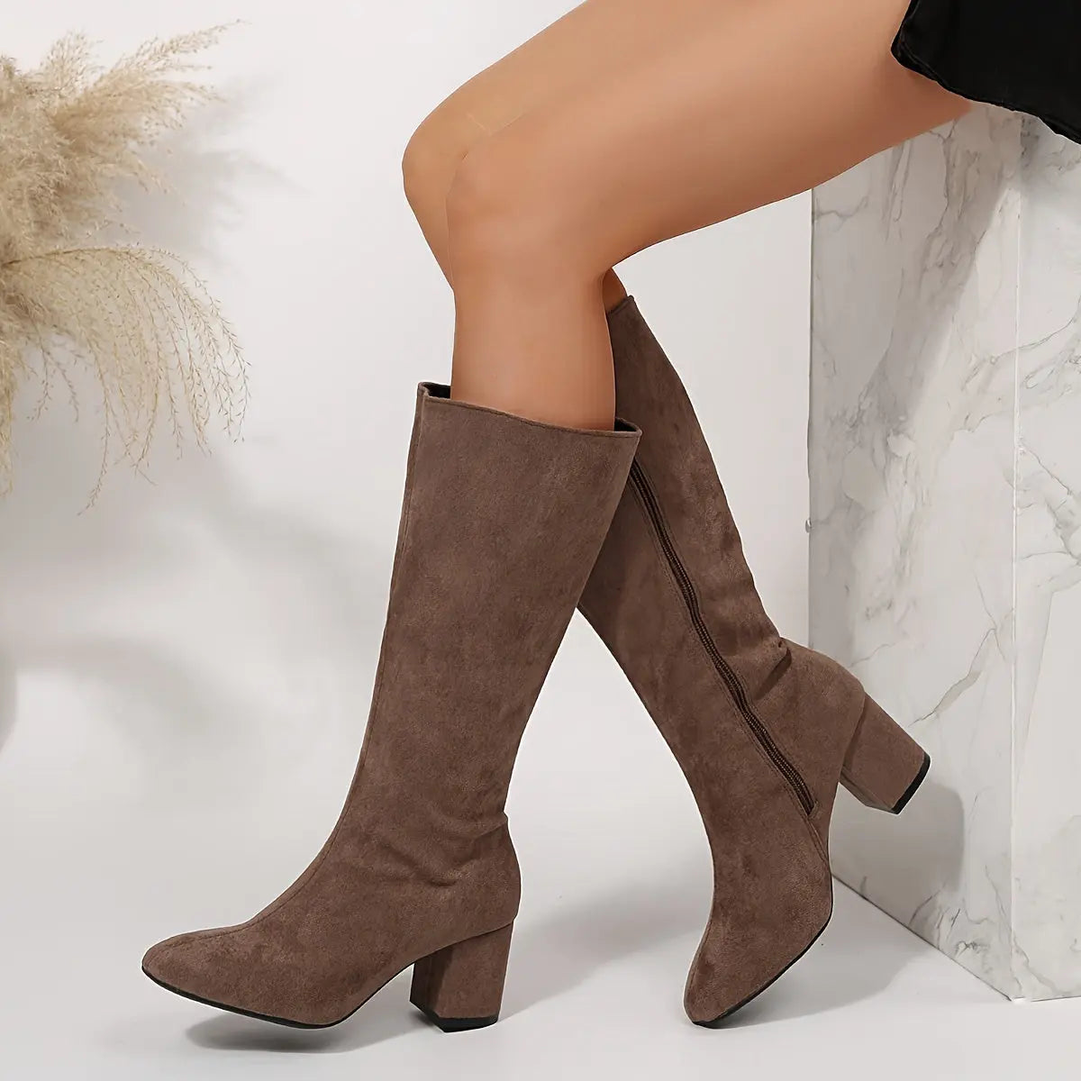 Casual outfit styled with empowering women's shoes and over-the-knee boots.