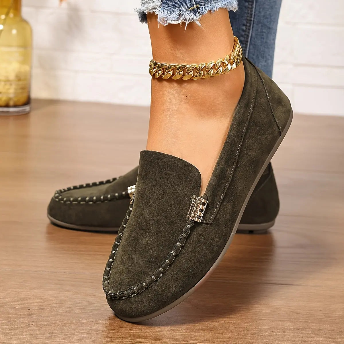 Model walking in whisper-soft loafers, demonstrating comfort and style.