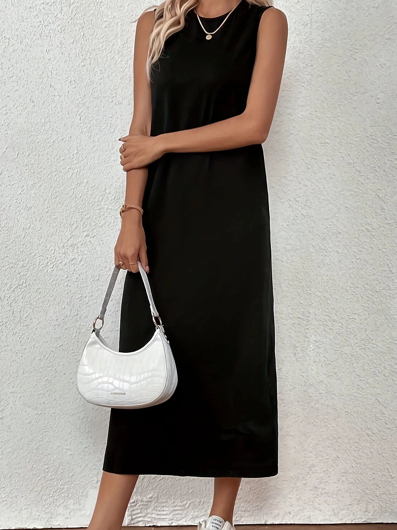 Model wearing the Midnight Whisper Maxi at a seaside resort, exuding effortless chic and poise.