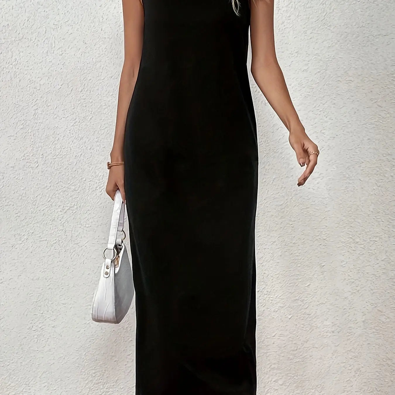 Midnight Whisper Maxi dress displayed on a hanger, showcasing its versatility for year-round style.