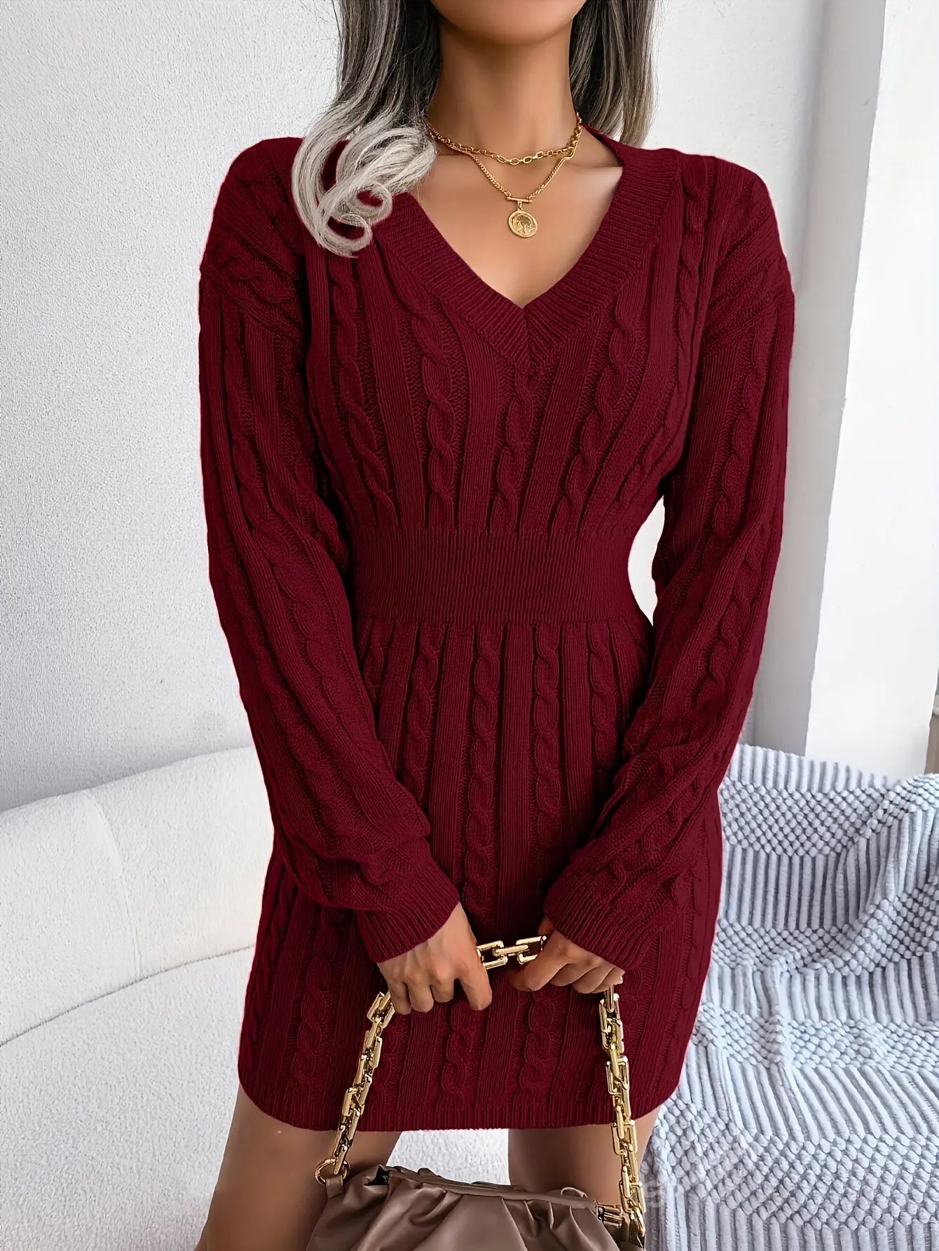 Elegant burgundy dress with a voluminous hem, perfect for winter weddings and parties.