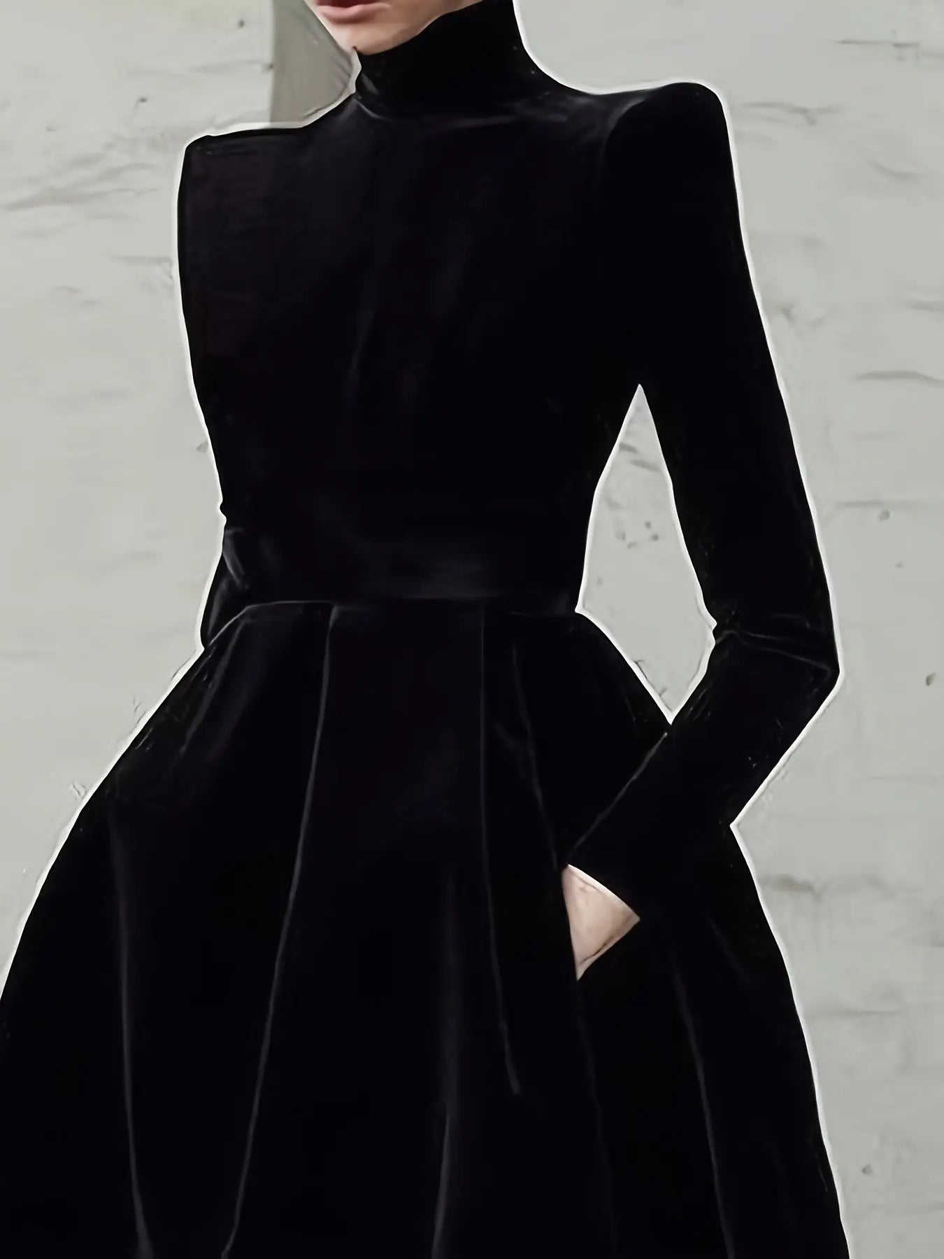A-line silhouette of the black evening gown, showcasing its midi length and graceful flow.