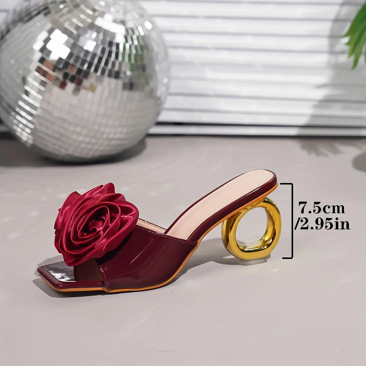 Close-up of Burgundy Bliss mules showcasing the striking geometric pattern.
