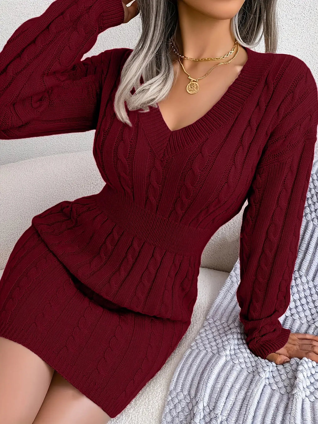Burgundy Bliss sweater dress with voluminous hem and V-neck, perfect for winter occasions.