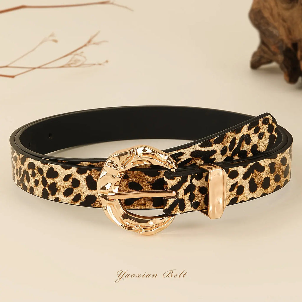 Golden Whispers Belt in leopard print with a golden-tone buckle, perfect for casual and elegant outfits.