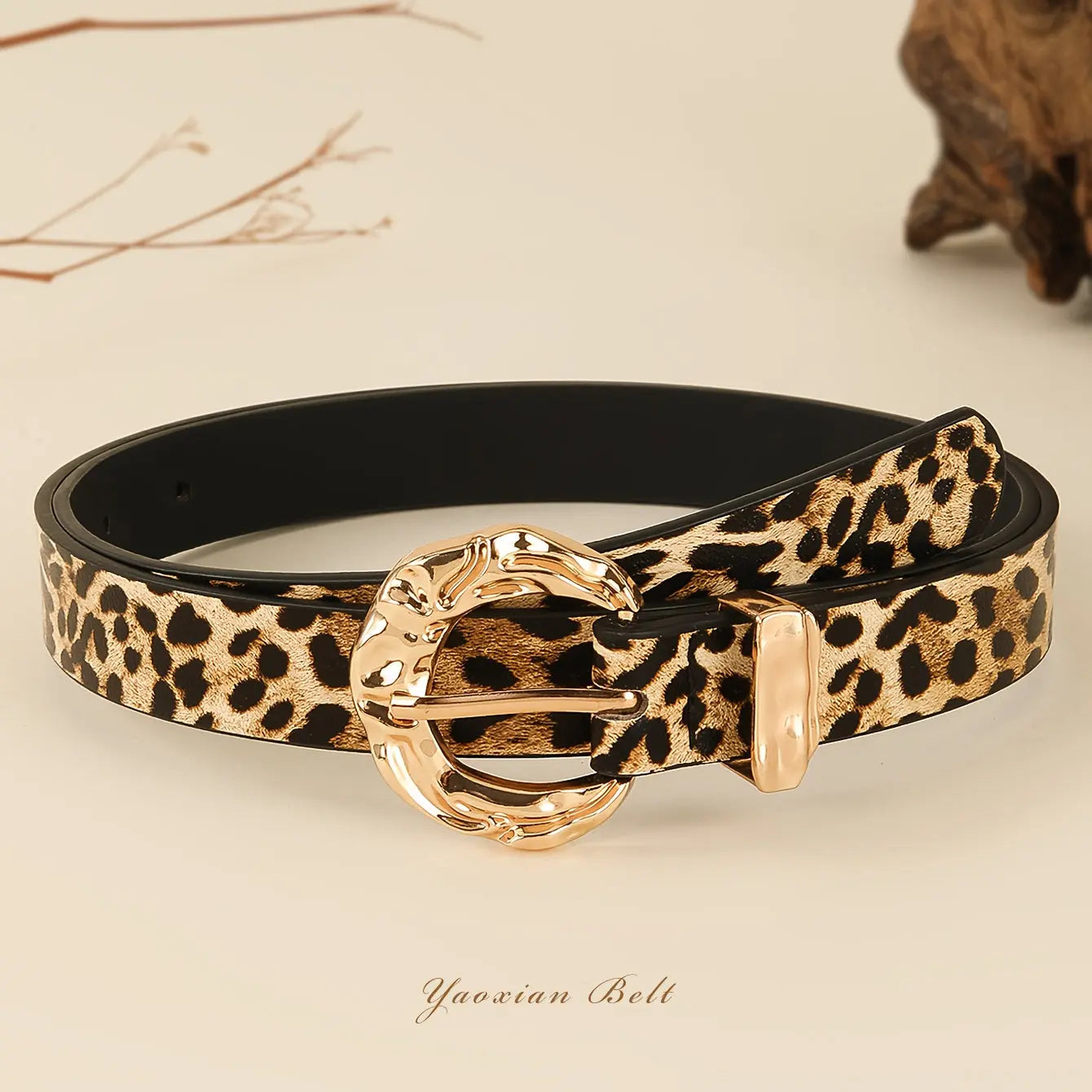 Golden Whispers Belt in leopard print with a golden-tone buckle, perfect for casual and elegant outfits.