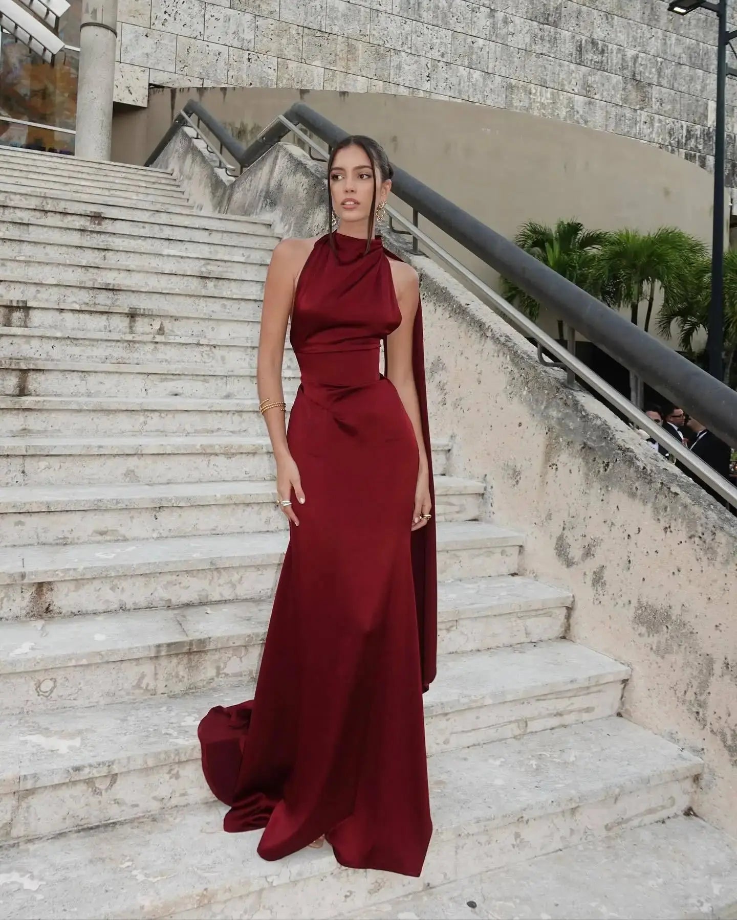 Elegant burgundy satin gown, ideal for formal events and glamorous nights out.