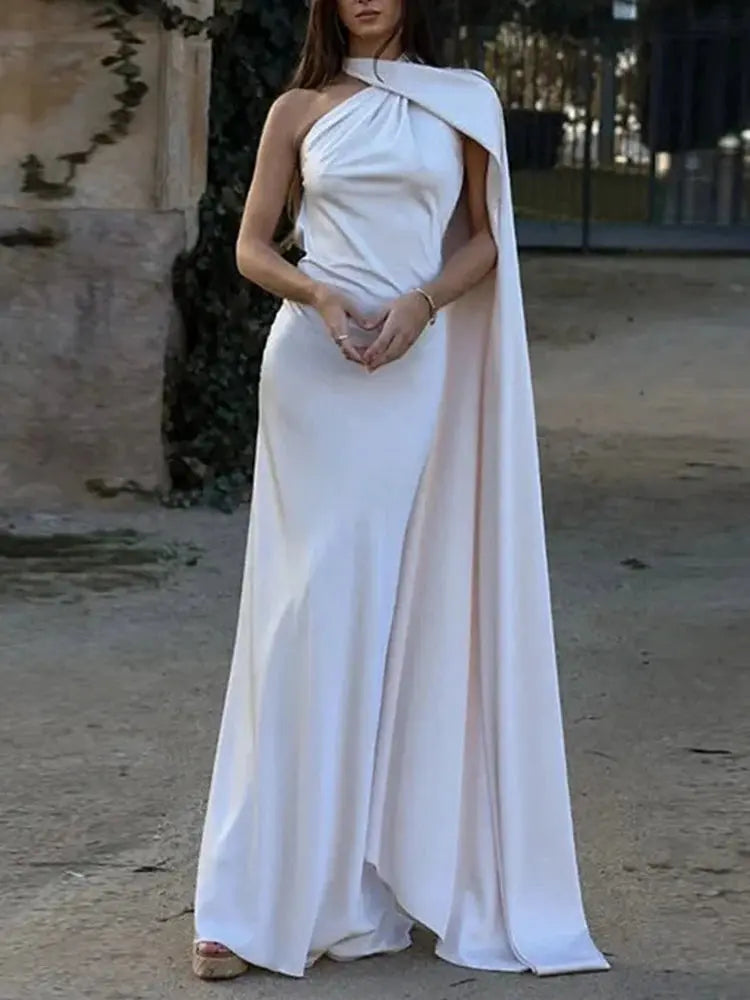 Model wearing the Midnight Allure Halter Gown at a formal event, exuding elegance.