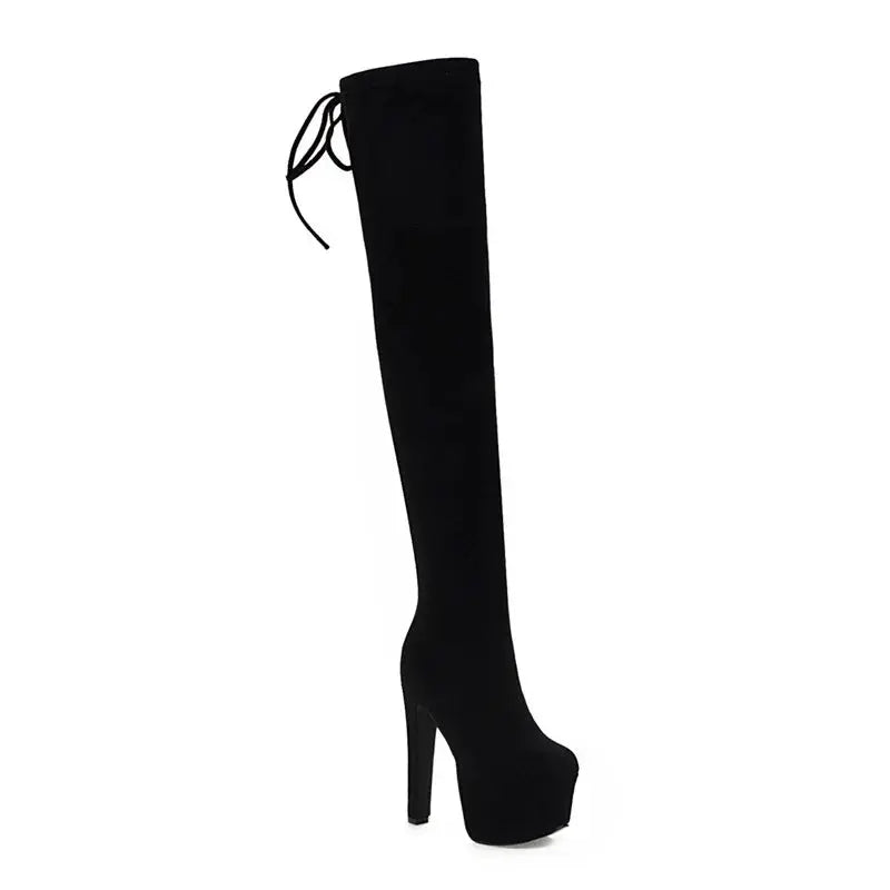 Stylish black thigh-high boots paired with a chic outfit for a trendy look.