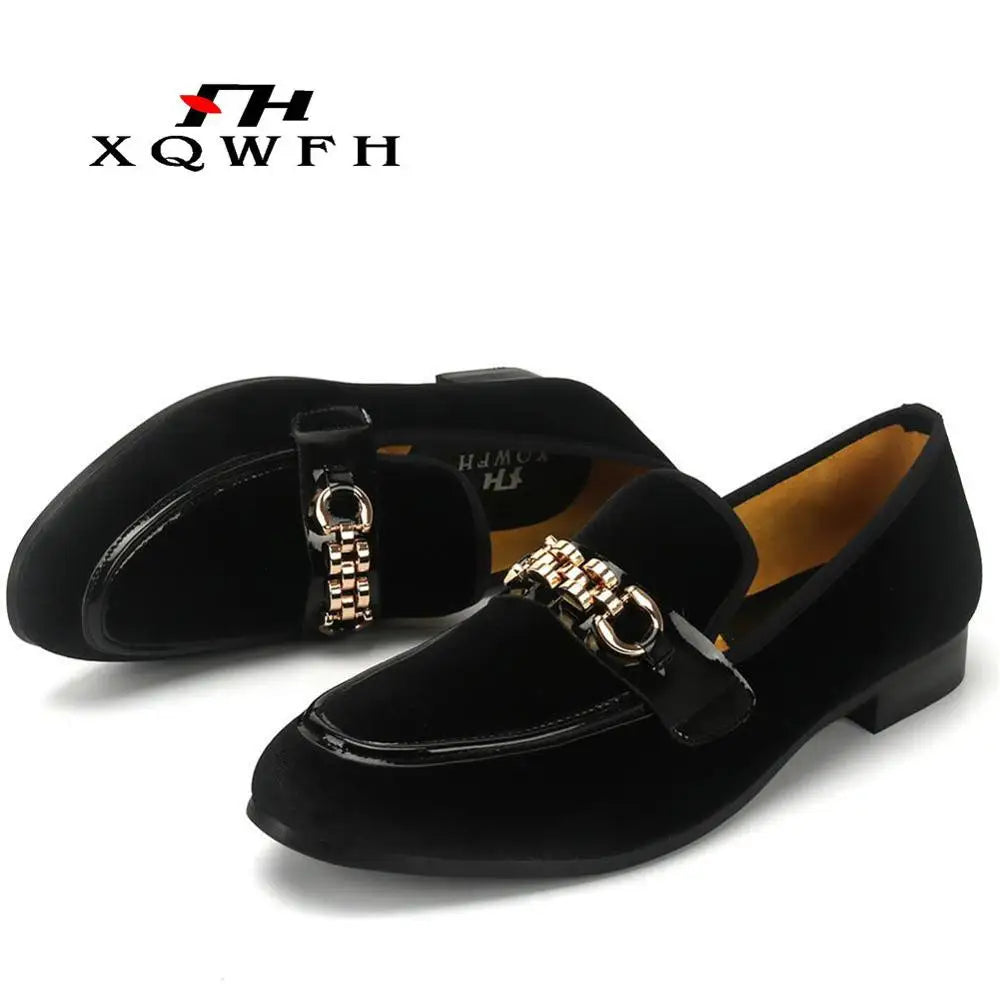 Side view of red velvet loafers showcasing sleek design.