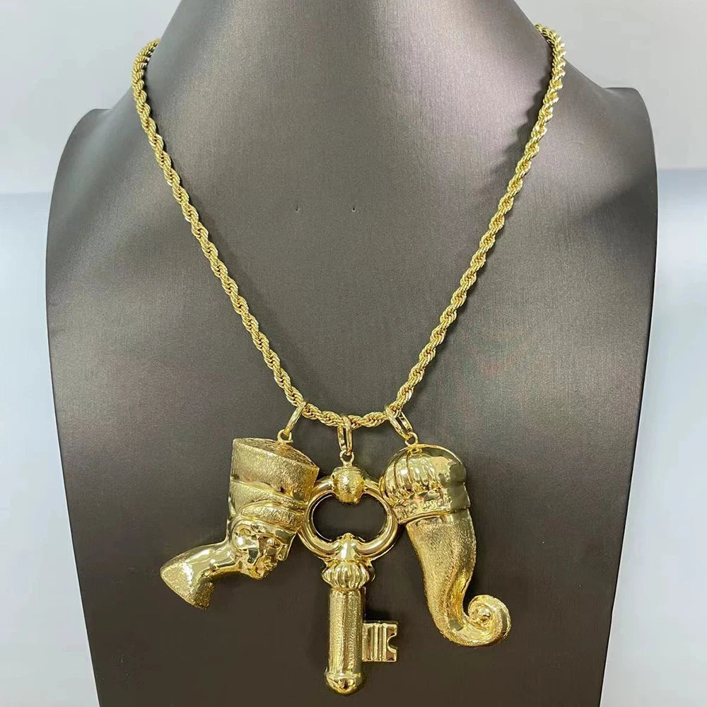 Complete gold-toned bridal jewelry set featuring coordinating earrings and bracelet with African-inspired design