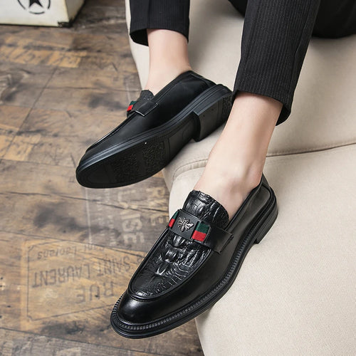 Close-up of genuine crocodile-textured leather loafer showing luxurious surface detail