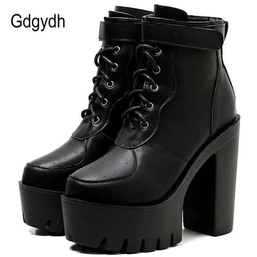 Black heeled ankle boots with block heel, platform sole, and adjustable side buckle on white background