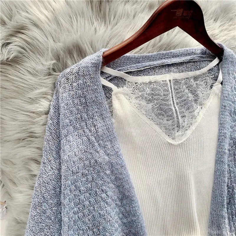 Back view of the loose-fit Breeze Whisper Cardigan, highlighting its flowing design and comfort.