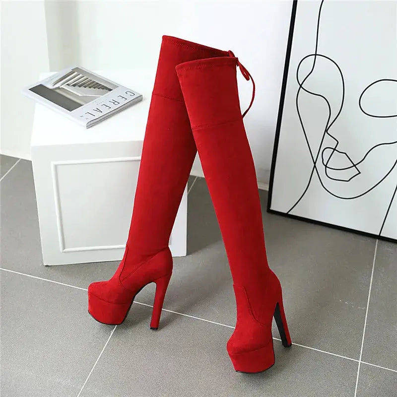 Model wearing Sky-High Confidence Thigh-High Boots at a gala event.