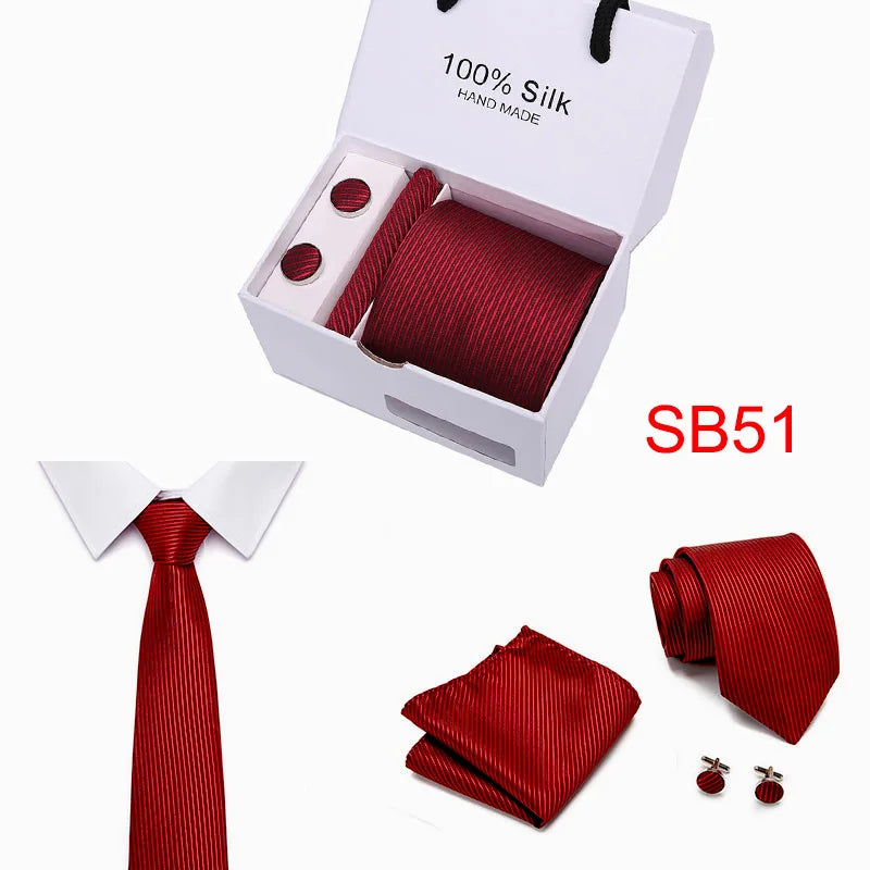 Red silk tie with matching accessories for a complete look.