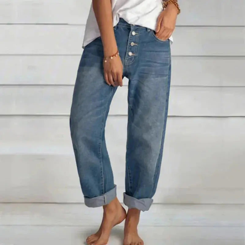 Flat lay of Sunlit Mornings wide-leg jeans paired with a crop top, showcasing stylish everyday wear.