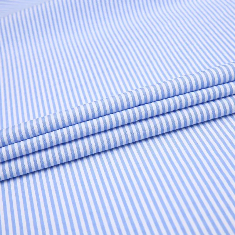 Detail shot of the turn-down collar on the striped dress shirt.
