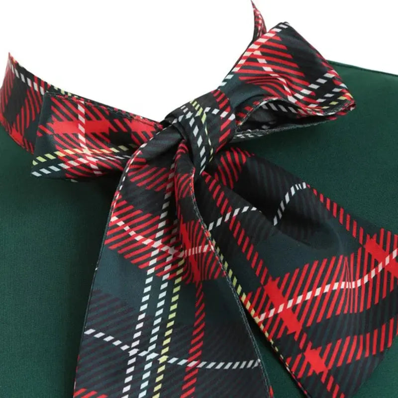 Back view of the vintage red plaid midi dress, highlighting its chic design.