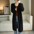 Cashmere Embrace cardigan in a warm autumn landscape, perfect for seasonal wear.