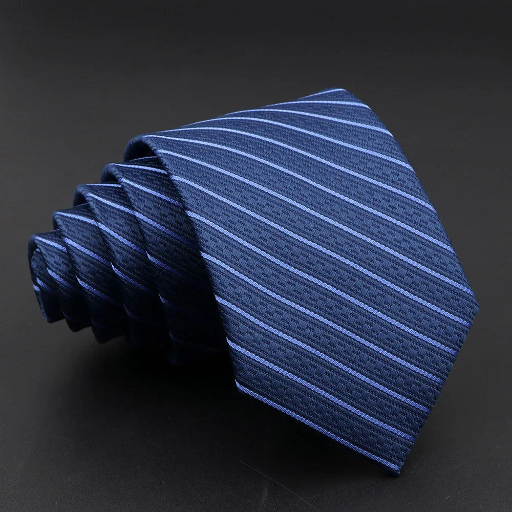 Versatile striped tie featuring intricate jacquard weaving and streamlined width