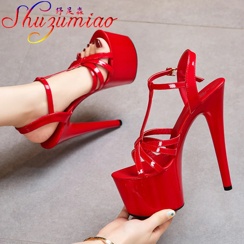 Bold red platform heels with secure buckle straps and glossy patent leather finish