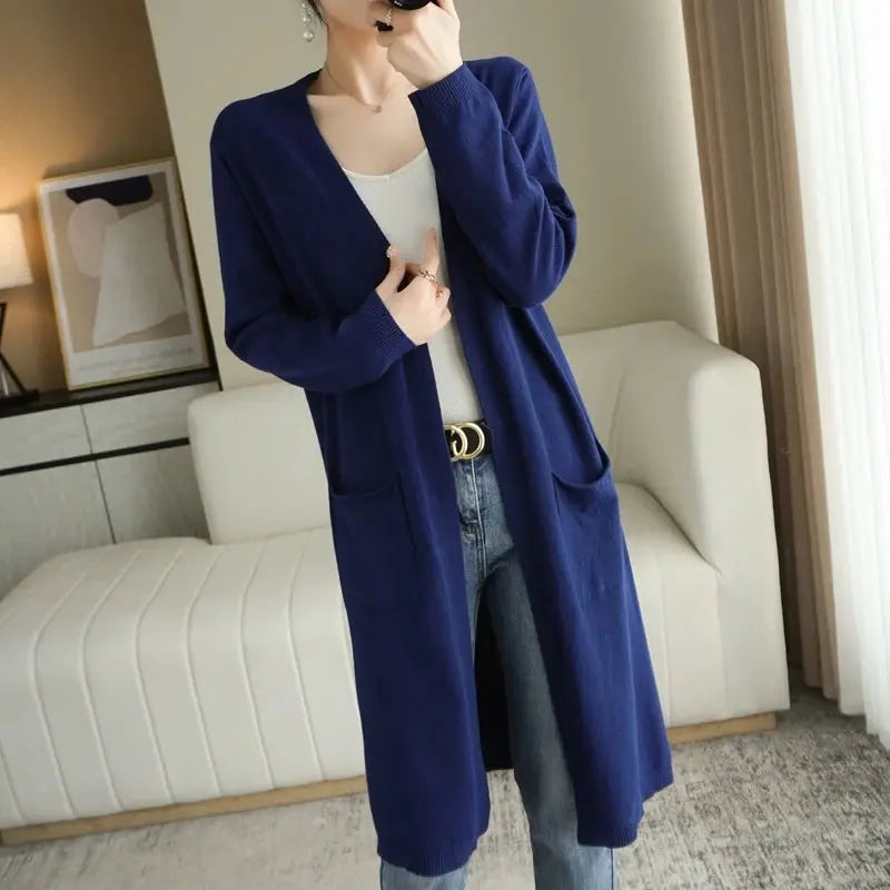Cashmere Embrace cardigan draping gracefully, highlighting its flowing lines.