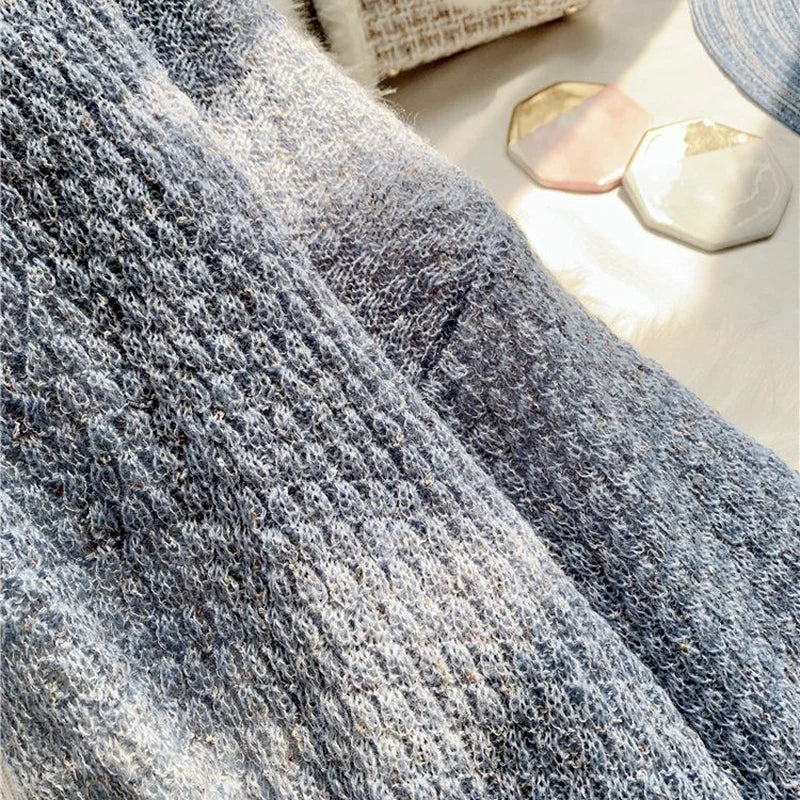 Breeze Whisper Cardigan draped over a chair, emphasizing its versatility for both casual and formal wear.