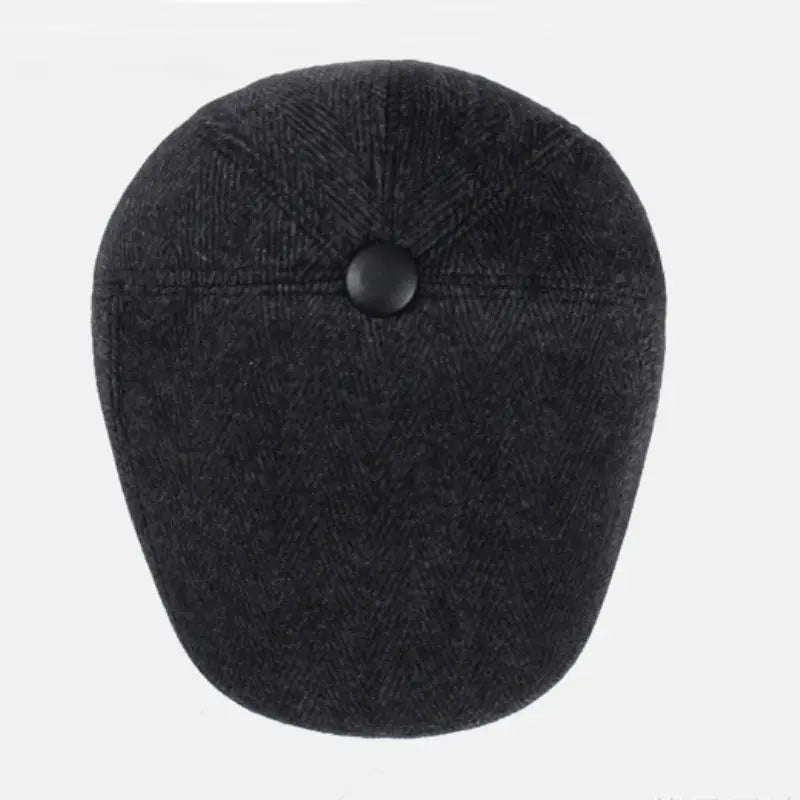 Stylish earflap beret in gray, combining warmth and classic fashion for winter outings.