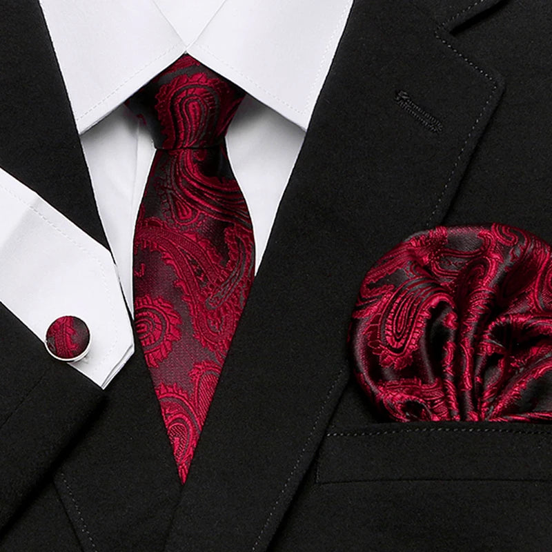 Red plaid tie set with matching cufflinks and hanky for a polished look.