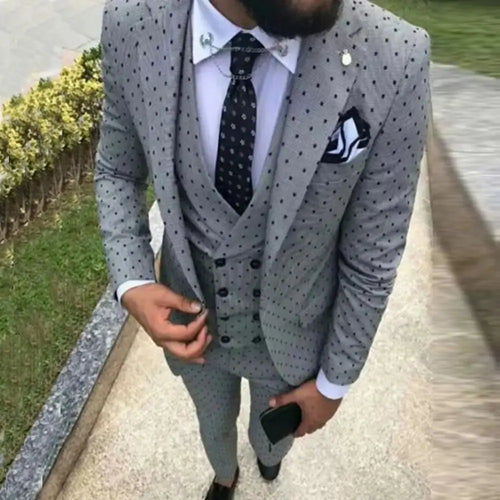 Three-piece tailored suit in navy blue, perfect for boardroom confidence.