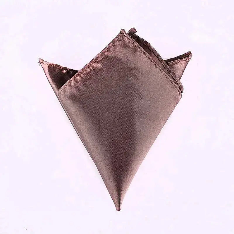 Sophisticated pocket square in burnt orange, folds neatly for personal expression.