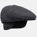Winter Whisperer beret in soft wool blend, featuring stylish earflaps for added warmth.