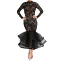 The gown's effortless pullover style shown on a mannequin in soft lighting.